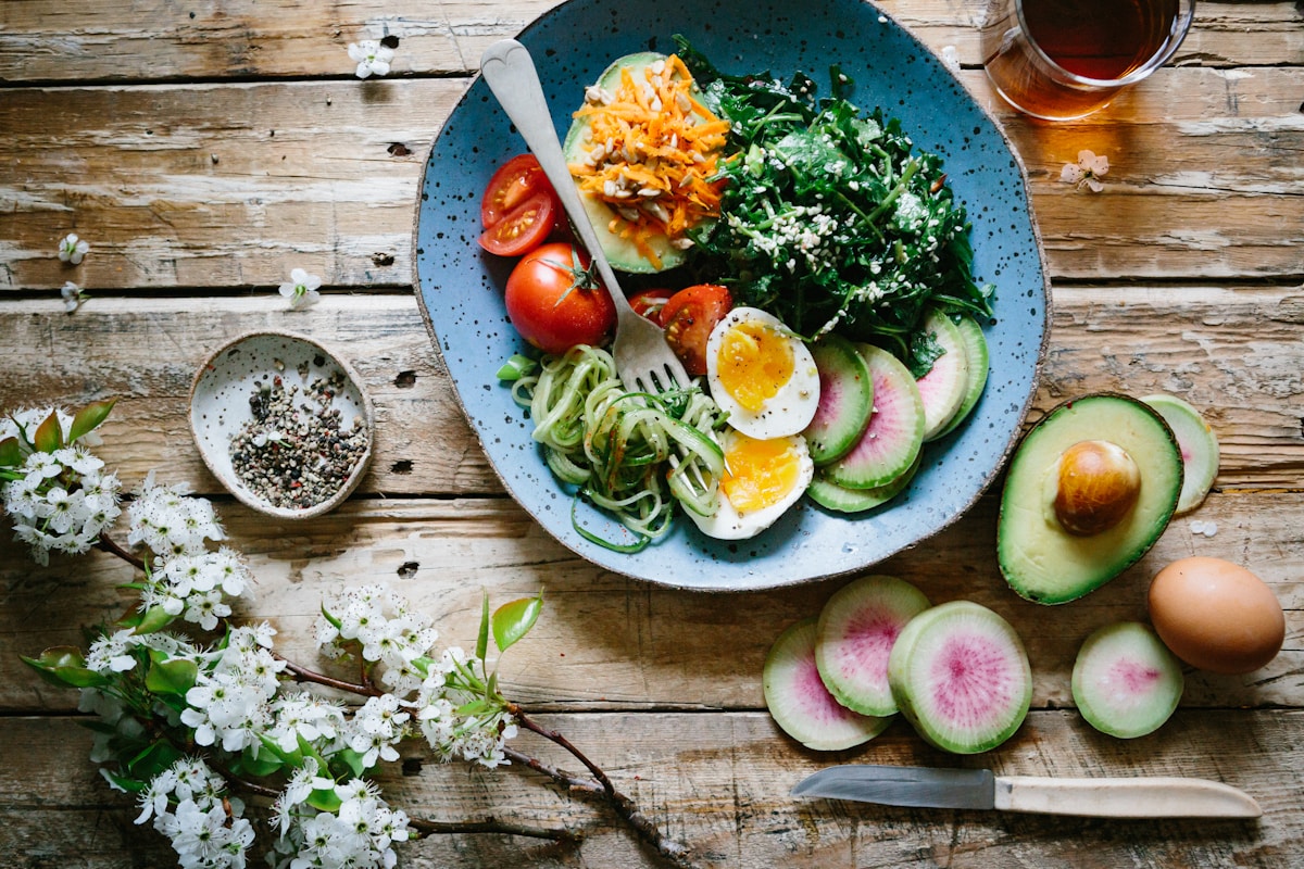 Poached eggs with vegetables and tomatoes on a plate for the egg diet