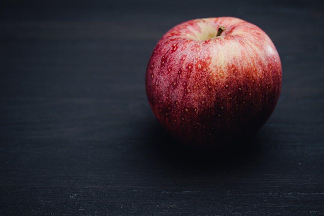 Apple on a light surface as an example of a high nutrient low calorie food