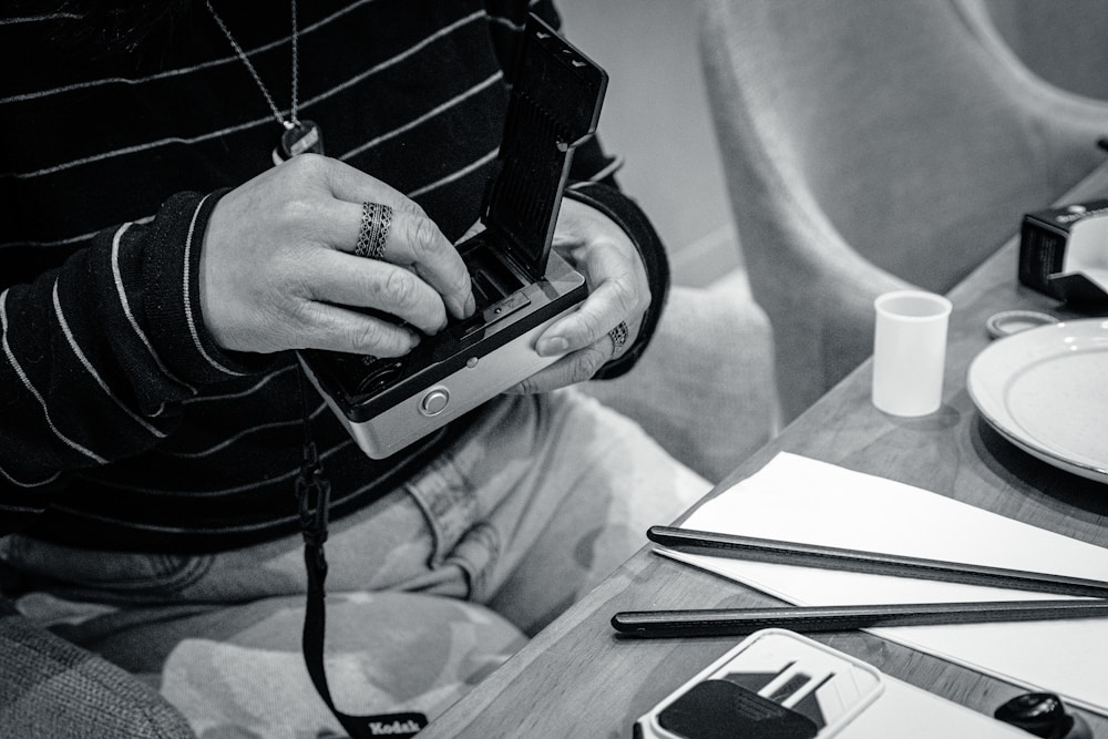 Person at a table using a calorie counting app in their routine