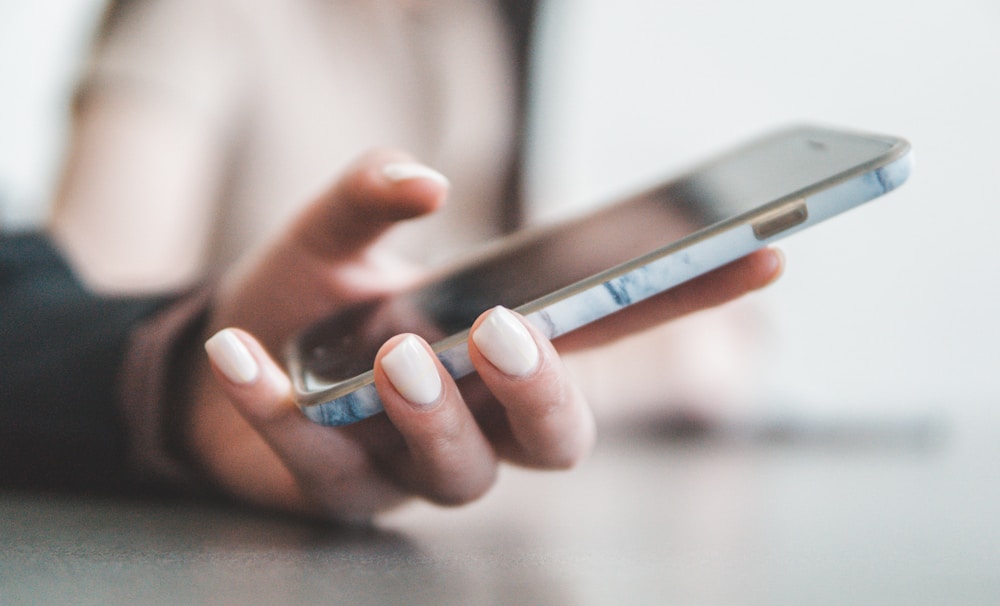 Phone in hand with a calorie counting app open