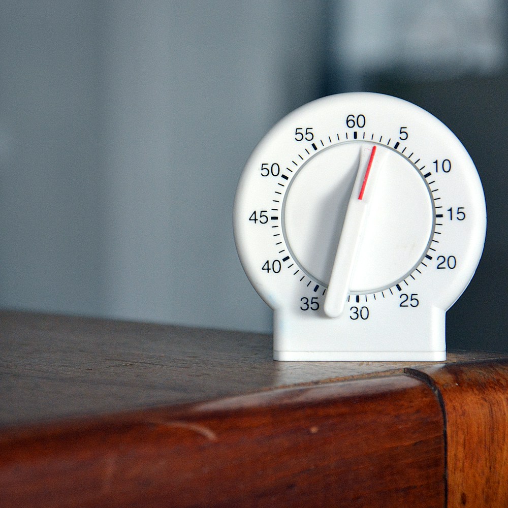 Analog timer marking the 20 second intervals of a Tabata style HIIT workout at home