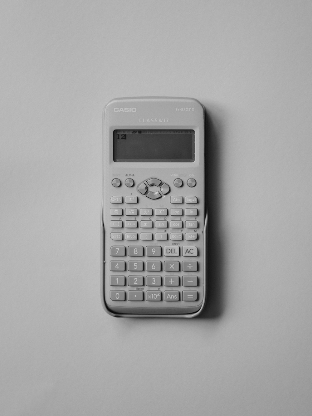 Calculator and a sheet listing the four formulas every ideal weight calculator uses